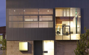 Night view of current facade - Photo Credit: Matthew Millman