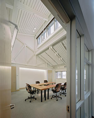 This photo of the conference room shows the tables made from wood salvaged from a nearby municipal yard. - Photo Credit: Peter Aaron / Esto Photographics