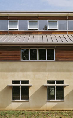 The south elevation, shown in this photo, includes windows for daylight and ventilation, the night sky spray system, and siding made from salvaged wine casks. - Photo Credit: Peter Aaron / Esto Photographics