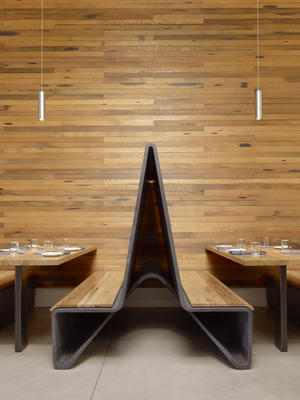 Ductal banquettes with reclaimed wood - Photo Credit: Matthew Millman