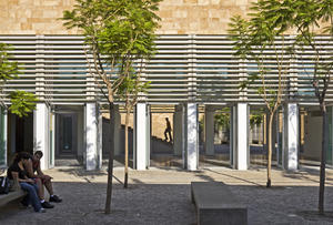 The photograph of the cafe courtyard shows shading and ventilation structures. - Photo Credit: Paul Crosby Studio