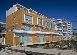 This photograph shows Synergy at Dockside Green's townhouses along the Greenway. - Photo Credit: Enrico Dagostini