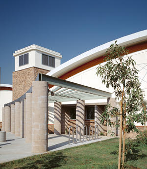 Bicycle parking at the end of the entry plaza, shown here, will be shaded by native Western Sycamore trees in 20 or 30 years. - Photo Credit: RMA Photography, Inc.