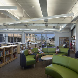 The library seen in the photo serves as a resource to the entire school as well as the community, so it is located in a prominent position at the intersection of the two wings. - Photo Credit: (c) Farshid Assassi