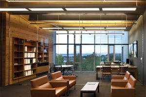 The conference room pictured in the photo features reclaimed wood office dividers and lots of daylight. - Photo Credit: Nic Lehoux