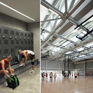 The gymnasium pictured in the photo features a sawtooth roof with clerestories that allow the space to be primarily daylit. - Photo Credit: (c) Farshid Assassi