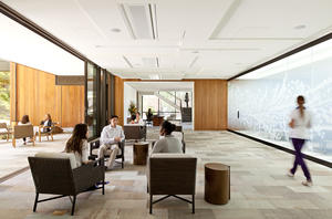 View of the foyer with courtyard to the left, large meeting room to the right, and lobby beyond. - Photo Credit: Jeremy Bittermann