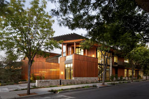 View of entry lobby and Second Street landscape with rain gardens in the foreground. - Photo Credit: Jeremy Bittermann