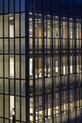 This photo highlights the curtainwall, including its solar shading, triple-glazed low-emissivity vision panels, eight-foot-high operable windows, and translucent double-cavity spandrel panels. - Photo Credit: © Peter Aaron/Esto