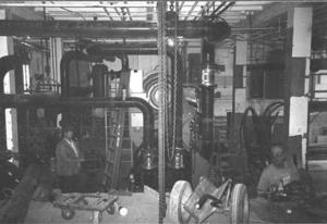 The crowded old mechanical room is shown in this photo. - Photo Credit: Susan Maxman & Partners
