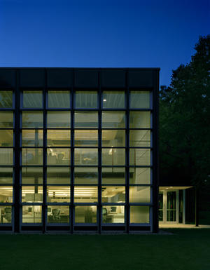 This photo of Building C1, taken at night, shows its new entry on the right. - Photo Credit: Mariusz Mizera
