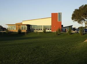 This photo shows a view of the multi-purpose building from the school's entrance. - Photo Credit: Michael David Rose