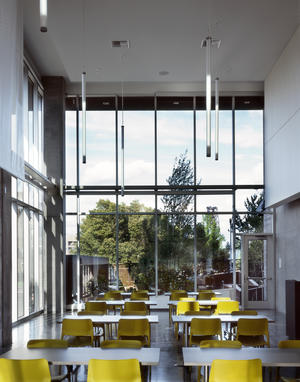 Generous daylighting and LED lighting used in one of Bud Clark Common's community rooms. - Photo Credit: Sally Schoolmaster