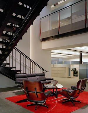 Returning the building to its structural and material simplicity is a central design element. The beauty of original structural materials – steel framing, decking, and brick – were revealed and became interior finishes. This photo of the central stair hall shows some of these exposed materials. - Photo Credit: Mariusz Mizera