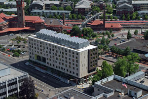 Aerial view of Bud Clark Commons' onsite PV array. - Photo Credit: SkyShots