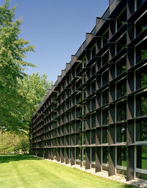 Passive shading is provided by integral, horizontal shading fins on the south, east, and west glazing, as well as by existing and new trees. This photograph shows the building's southern facade. - Photo Credit: Mariusz Mizera