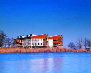 The headquarters is visible across the Chesapeake Bay in this photograph taken from the west. - Photo Credit: Prakash Patel, courtesy of SmithGroup