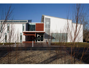 This photograph shows the entry, with a rain garden in foreground. - Photo Credit: © Peter Vanderwarker 2008