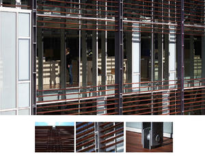 The full-height glass curtainwall that wraps around the courtyard of the building, shown in the top photograph, strengthens the connection between the exterior landscape and the work environment, and harnesses the sun’s light and warmth. Jarrah louvers and screened glass, in detail photos, ward off heat in the summer while allowing sunlight to warm the major interior spaces in winter. Jarrah wood is an Australian subspecies of eucalyptus with rapid growth cycles and high natural rot resistance that is highly resistant to rot and decay without chemical treatment. - Photo Credit: © Peter Vanderwarker 2008