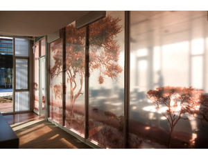 The client's mission—protecting wildlife-is reflected at all scales of the building. Shown in this photograph is one of the translucent images of various wildlife and habitats visible on expansive glass partitions in the collaboration rooms. - Photo Credit: © Peter Vanderwarker 2008