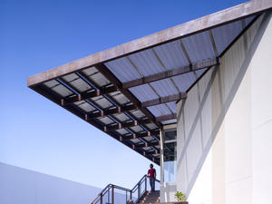 Detail of the large southwestern overhang with the 12kw solar system - Photo Credit: John Edward Linden