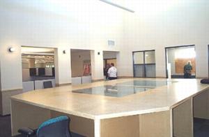 The table in this photograph, which is used for map-reading, is lit by natural daylight.