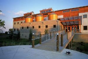 To decrease water use and runoff, a rainwater catchment system on the Philip Merrill Environmental Center, shown in this photo, captures rainwater for use in fire suppression and in the building's sinks. - Photo Credit: Williamson, Robb