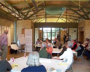 The flexible spaces in the building can be put to many uses, such as the community meeting in this photo. - Photo Credit: Ron Sprouse