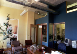 The interiors of the CCI Center, shown here, are bright and warm, invigorating occupants with access to daylight, views, and fresh air. Salvaged materials such as stained-glass windows give the building a comforting atmosphere. - Photo Credit: Conservation Consultants, Inc.