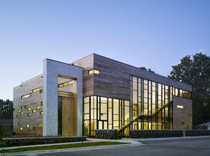 This photograph shows the southwest corner of the building, at dusk. - Photo Credit: Steve Hall, Hedrich Blessing