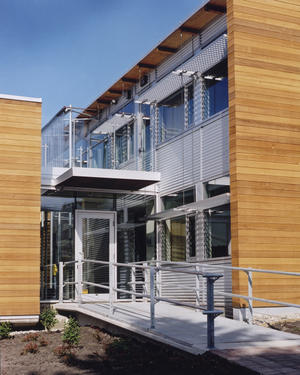 Building materials are appropriate to both the building typology and to the region and its climate. The wood-frame building includes reclaimed timbers and roof decking. The building is clad in locally harvested and manufactured West Coast cedar. - Photo Credit: Enrico Dagostini