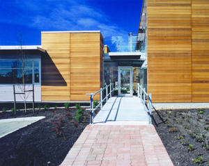 This photograph of the building's entrance shows the division between the two pavilions. - Photo Credit: Enrico Dagostini