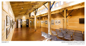 North-facing clerestory windows, shown in this photo, daylight the exhibit hall. Stained concrete floors connected to the ground-source heat-pump system provide radiant heating and cooling. The floor's thermal mass reduces temperature fluctuations. - Photo Credit: The Kubala Washatko Architects, Inc./Mark F. Heffron