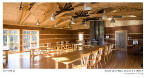 Site harvested cherry, maple, and other woods were used as finish materials and furniture throughout the building, as shown in this photo of the conference room. Plaster walls are made of locally obtained sand, clay, and straw. - Photo Credit: The Kubala Washatko Architects, Inc./Mark F. Heffron