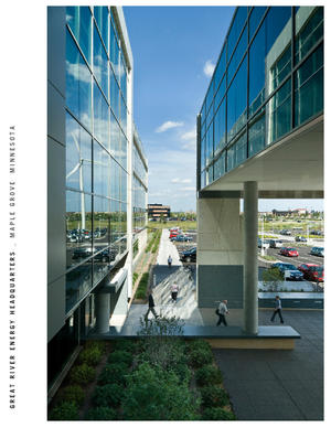 In this photograph the reflection of a wind turbine in the building's glazing is visible. - Photo Credit: Don F. Wong