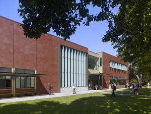 This photo shows the main building entrance and east facade at new student quad. - Photo Credit: Tim Griffith
