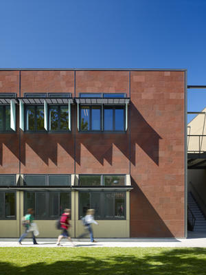 This photograph is of the eastern facade, showing sunshading and glass canopies. - Photo Credit: Tim Griffith