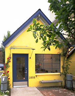 This photo shows the use of a hatchback as an awning, a tailgate as a bench, and water heaters as catch basins. - Photo Credit: Ethan Kaplan