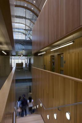 This photograph shows the interior view of the central stair from the second floor. - Photo Credit: Hopkins Architects