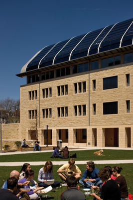 This photograph shows the south courtyard's green roof on top of underground service node. - Photo Credit: Hopkins Architects