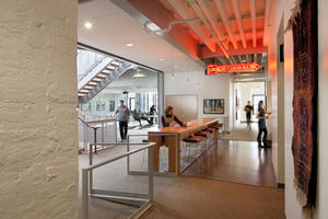 Structural systems were left exposed and minimal finishes applied to save materials - Photo Credit: Lara Swimmer