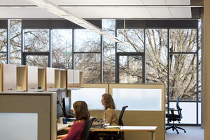 The furniture used a new “benching” system comprised on a spine with movable tables and files - Photo Credit: Lara Swimmer