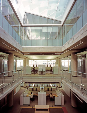 Three-story atria, including the one shown in this photo, carry light deep into the space. - Photo Credit: Hester + Hardaway