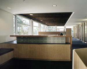 Workspaces are all adjacent to windows to maximize occupants’ ability to control their environment and afford the occupants access to views to the outdoors. This photo shows the use of both exterior and interior glazing to bring daylight deep into the building. - Photo Credit: Enrico Dagostini