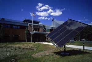 A 1 kW thin-film PV system on a tracking system, shown in this photo, and a 14.3 kW PV system on the roof offset some of the energy use of the Cambria office building. - Photo Credit: Robb Williamson
