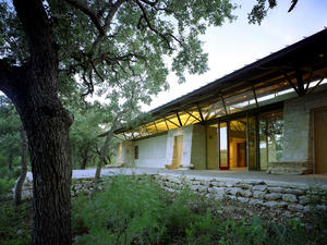 Xeriscaping and plant exhibits, shown in this photograph, replaced damage from site construction. The building was sited to have a low site impact. - Photo Credit: Greg Hursley
