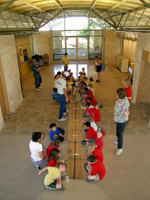 Seasonal cycles are illustrated by a meridian line and sky map embedded in the terrazzo floor, shown in this photograph. - Photo Credit: Ron Sprouse
