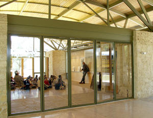 The doors in this photo open, dissolving the wall between the indoors and outdoors. - Photo Credit: Ron Sprouse