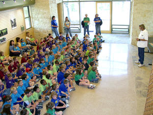The flexibility of the building allows student and community groups to occupy several different areas of the building, as this photo of a student group illustrates. - Photo Credit: Ron Sprouse