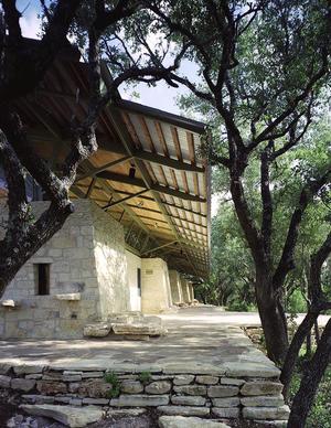 Eight-foot overhangs, shown in this photo, shade the sides of the building. - Photo Credit: Greg Hursley